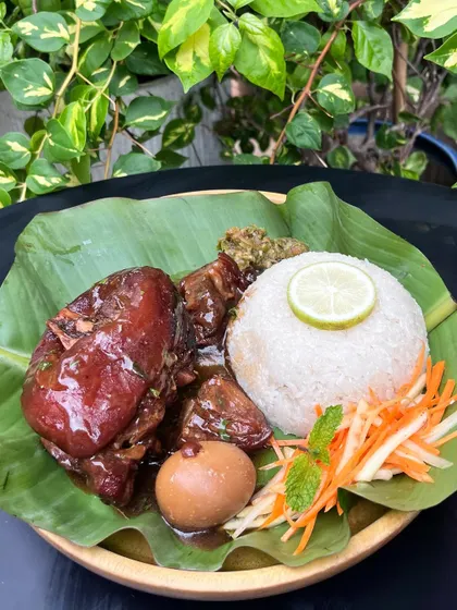 Our Sweet Pork Knuckles are a weekend special you won't want to miss. The knuckles are slow-cooked until tender and glazed in a sweet and savory sauce, served with sticky rice and a fresh salad chutney.