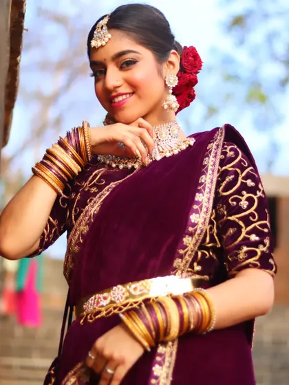 A confident and radiant portrait of the bride, ready for her reception party.