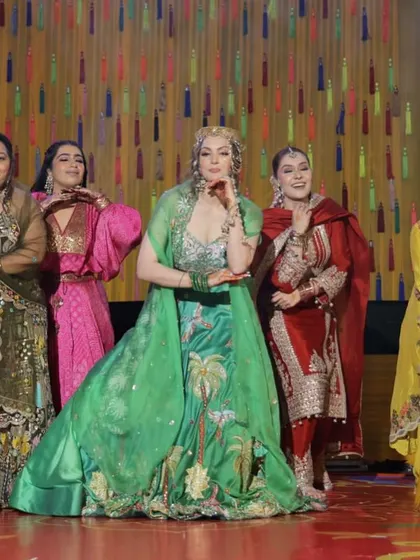 The bride and her squad striking a final pose. A well-choreographed group dance is one of the best ways to kick off the sangeet night celebrations.