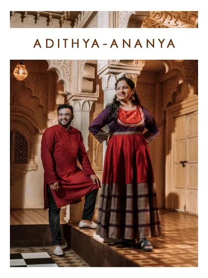 A regal portrait of a couple in a beautifully designed indoor setting with intricate arches and a checkered floor.