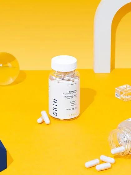 A clean and modern setup for Atom Health's supplements. We used abstract geometric props and a bright, color-blocked background to create a scientific yet approachable look.