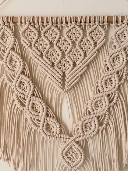 The full pattern of this V-shaped macrame wall hanging, showcasing its elegant and timeless design.