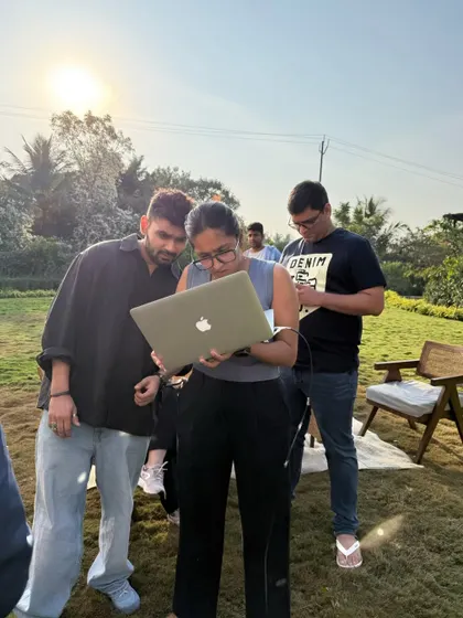 Reviewing the shots on the laptop is a crucial part of the process. Here, my team and I are checking the images on location to make sure we've nailed the vision before moving on.