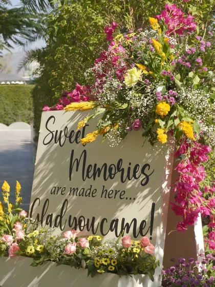 A sweet and personal touch with a welcome sign adorned with vibrant flowers, making guests feel cherished from the moment they arrive.