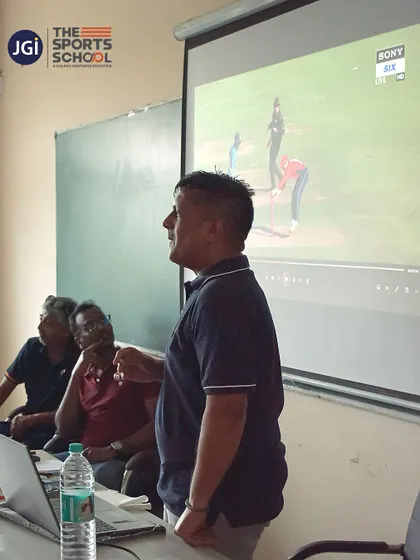 An expert uses a presentation to break down game scenarios, teaching our athletes to think strategically.