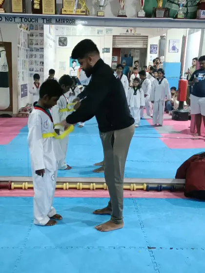 Another young student earns his yellow belt.