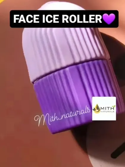 A product shot of the Face Ice Roller in a pretty purple color. It's a simple tool that you just fill with water, freeze, and then roll over your skin for a calming, cooling massage.