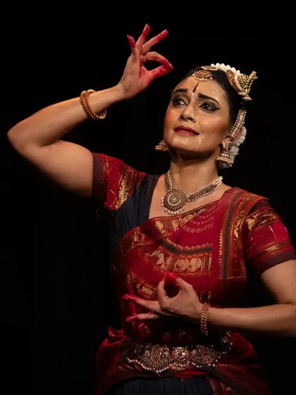 A moment of quiet contemplation, captured in a close-up at the Diaspora Dance Festival.