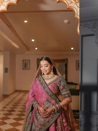 A beautiful portrait of the bride in a palace hallway, the composition using architectural elements to frame her perfectly.