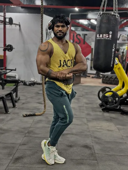 A side pose showing the full length of the physique. Every muscle group has to be developed for a balanced look.