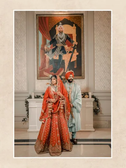 A classic portrait of the couple in front of a large, regal painting, adding an artistic and historical feel to their wedding photo.
