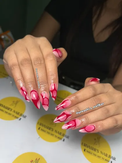 Bold and confident, this abstract design uses sharp lines and soft curves in shades of pink and red. The glossy, artistic swirls create a statement look that's impossible to ignore.