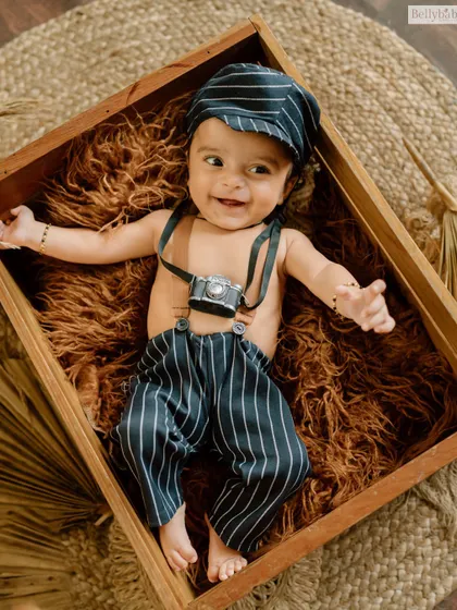 A full, happy smile from our tiny photographer. These themed shoots are all about letting kids play and be themselves.
