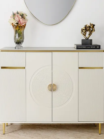 This cream-toned cabinet is where function meets quiet luxury. I designed it to be incredibly versatile, with generous internal storage for everything from crockery to linens. The clean lines, textured door details, and subtle gold accents make it a statement of refined, modern living.