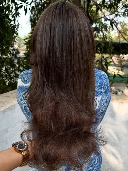 A 'Warm Caramel' color, perfect for adding a sun-kissed glow.
