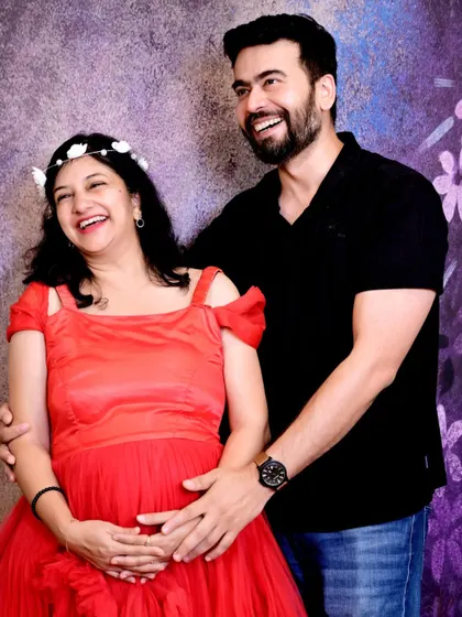 I love capturing genuine laughter during my sessions. This candid moment of joy between the expecting couple makes for a truly memorable and authentic maternity photo.