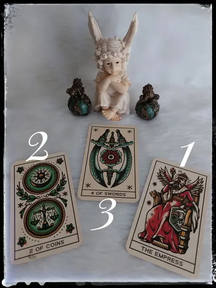 Here are the revealed cards for June 2023: The Empress, the 2 of Coins, and the 4 of Swords. Each card holds a different message for the month.