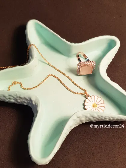 The teal starfish tray is a simple way to add a bit of color and personality to your space.