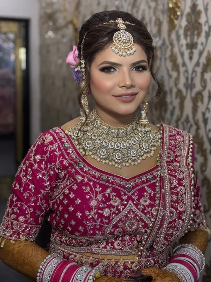 A happy bride ready for her big day. Her smile says it all. The makeup is set to last through tears, laughter, and a long day of celebrations while looking absolutely flawless.