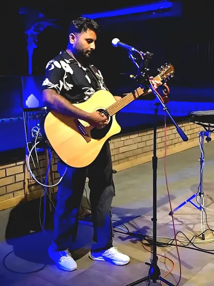 Focused on the music during a live gig. Every show gets my full attention, whether it's for a small cafe or a large festival.