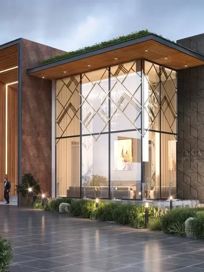 Located in Chattarpur, New Delhi, this farmhouse design emphasizes transparency and light with a double-height glass facade. The goal was to blur the lines between the luxurious interior and the expansive, landscaped exterior.