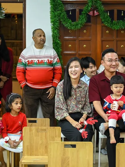 A beautiful multi-generational photo of a family enjoying the Christmas celebration.