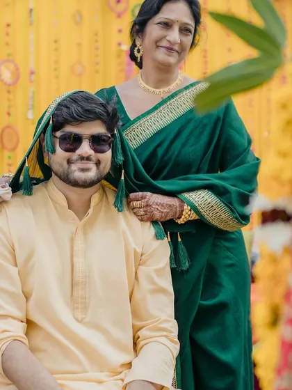 A sweet moment between the groom and his mother during the haldi ceremony. This portrait captures the love and blessings of family.