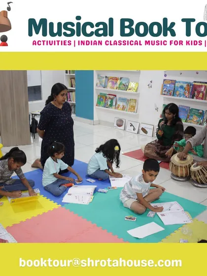 Listen, learn, and express. Children at our book tour event are engaged in coloring activities while listening to live classical music.