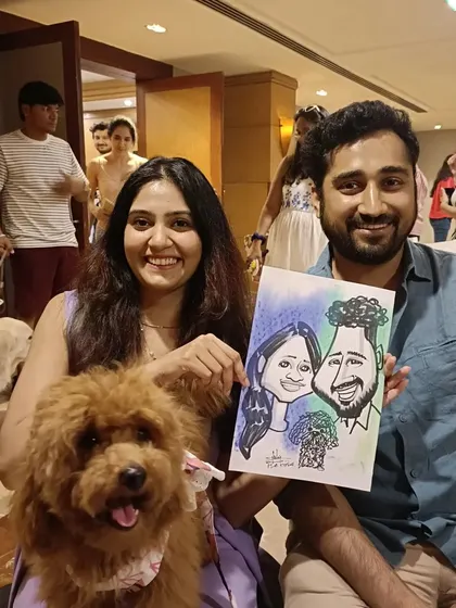 This couple brought their poodle along to a pet-friendly event, so of course, I had to include him in the caricature. It makes for a complete family portrait.