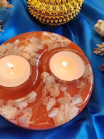 An orange and white floral tealight holder, another beautiful option for your festive decor.