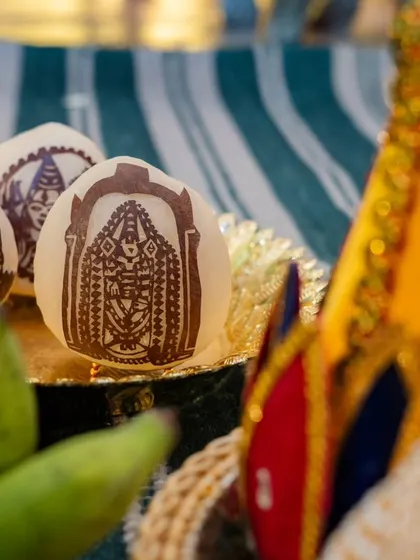 An example of the personal touches I add to traditional ceremonies. These coconuts are intricately decorated with religious symbols, showcasing a high level of detail and craftsmanship.