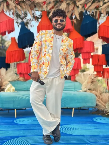 A great emcee is like a perfectly tailored suit. This yellow floral blazer was designed by me for a Goa wedding.