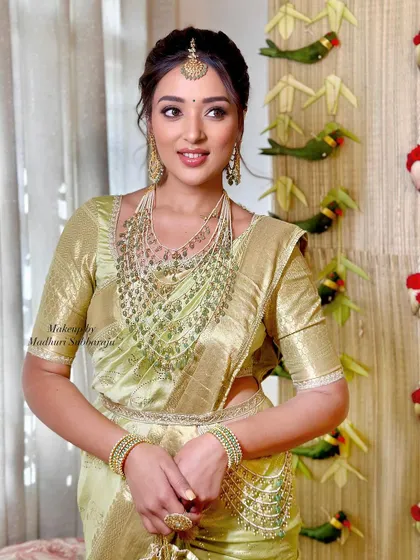 A three-quarter shot showing the full effect of the Vratham look, with its blend of traditional attire and modern styling.