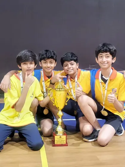 The victorious U-12 boys doubles team celebrating their win at the Mount Litera School International inter-school tournament.