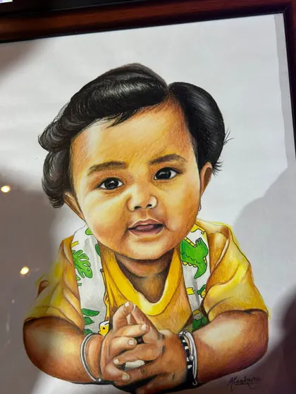 A close-up of a baby's portrait, framed and ready. I take great care in capturing the soft features and innocent expression of little ones.