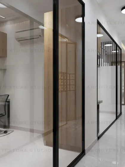 The hallway of the transportation office, with black-framed glass partitions that create a sleek and modern look.