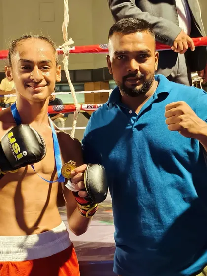 A close-up with the champion. This picture captures the bond between a coach and his fighter.