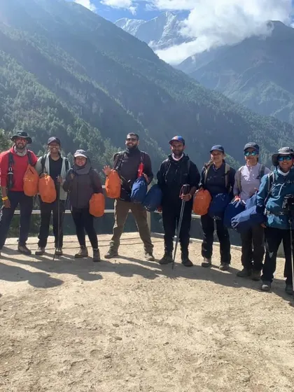 The team back in Lukla, holding bags of trash collected from the mountain. We are committed to responsible trekking and leaving the trails cleaner than we found them.
