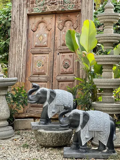 Welcome good fortune with this pair of grand elephants at your entrance. Handcrafted from black granite with intricate adornments, their raised trunks greet with gladness and offer blessings to all who enter.