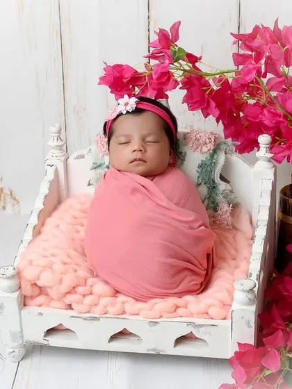 Another angle of our pink floral setup, showing the baby swaddled snugly. I use different poses and angles to provide a variety of beautiful shots from each theme.