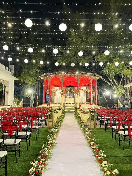 The full setup for a beautiful reception at The Tamarind Tree, showcasing the elegant lighting and seating arrangement.