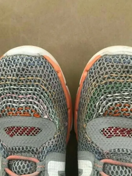 A beautiful example of visible mending on a pair of running shoes. We teach kids that repairs do not have to be invisible; they can be a creative expression that adds character and tells a story.