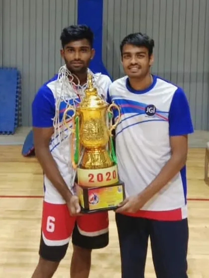 Holding the All India Inter-University championship trophy with a teammate. A testament to our hard work and dedication.
