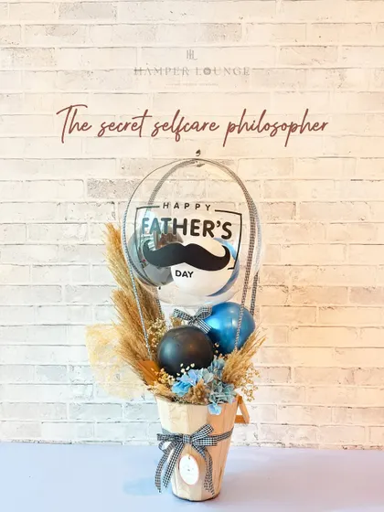 For the dad who is a secret self-care philosopher, this simple and stylish hamper with a "Happy Father's Day" balloon is a perfect, understated gift.