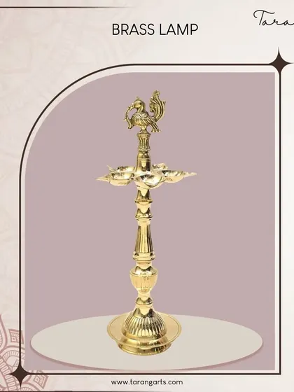 This brass lamp is topped with an Annapakshi, a mythical white bird from Hindu mythology symbolizing purity and prosperity. This ornate detail adds an extra layer of meaning and artistry to the traditional Kuthu Vilakku.