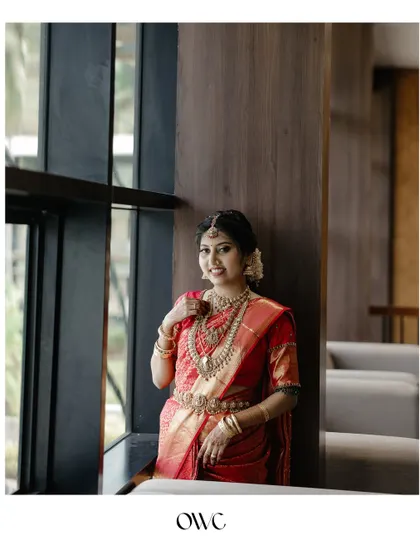A beautiful bridal portrait by a window in a modern setting.