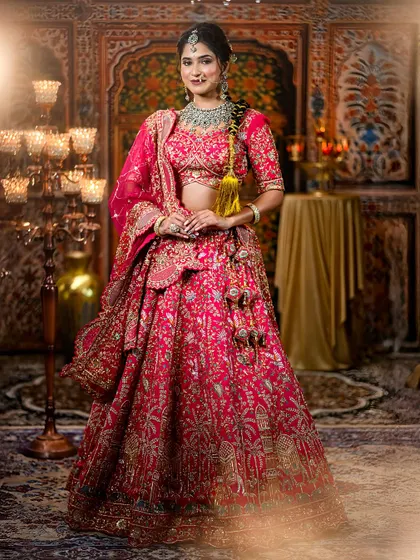 Another full-length view of the bride, showing the beautiful flare of the lehenga and the intricate details of the embroidery.