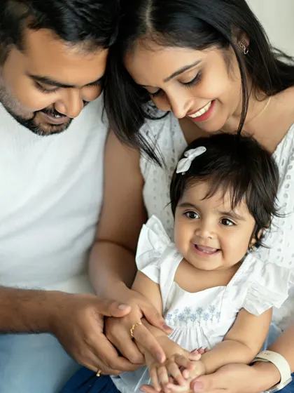 A duplicate of image 159, a close-up of a happy family. The focus on their faces and loving interactions makes this a very intimate portrait.