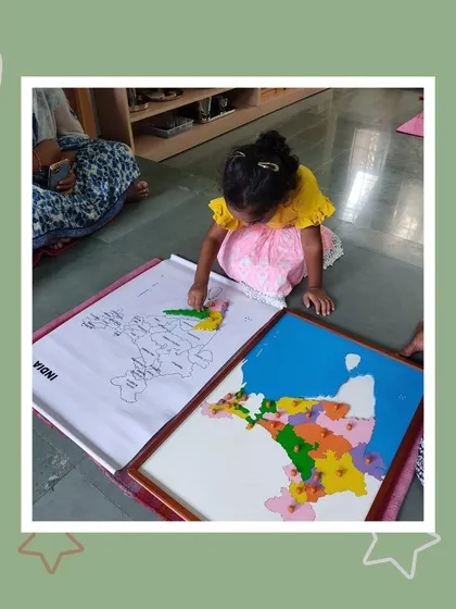 Joshya works on the map of India, learning the shapes and locations of the states. This hands-on approach to geography makes learning about her own country engaging and memorable.