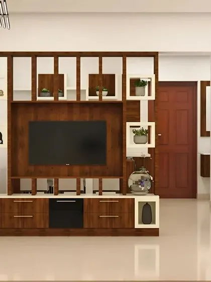 A TV unit that also functions as a room partition. The open geometric shelving allows light to pass through while creating a visual separation between the living room and the entryway.
